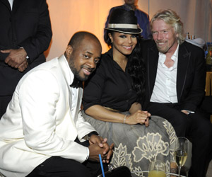 Jermaine Dupri, Janet Jackson and  Sir Richard Branson  Photograph by: Getty Images/Atlantis, The Palm