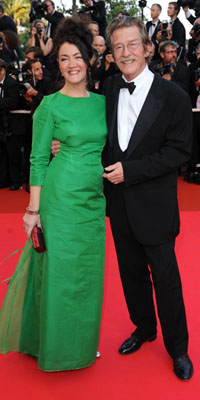 Actor John Hurt and guest arrive at the Indiana Jones and The Kingdom of The Crystal Skull Premiere  Photo by: Gareth Cattermole 2008 Getty Images