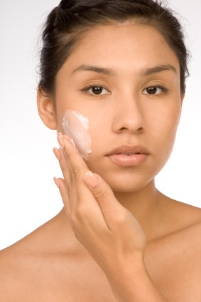 Picture of model putting on facecream used for webchat on anti-aging creams